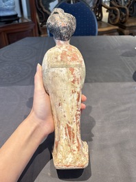 Two Chinese polychrome pottery figures and a female head, Tang