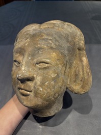 Two Chinese polychrome pottery figures and a female head, Tang