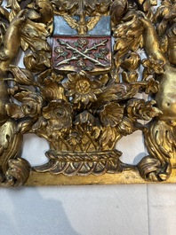 A baroque gilt carved wooden panel with an unidentified family crest, possibly Germany, 18th C.