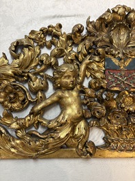 A baroque gilt carved wooden panel with an unidentified family crest, possibly Germany, 18th C.
