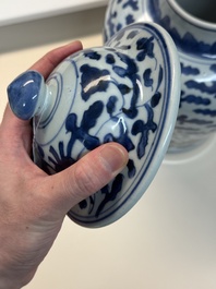 A Chinese blue and white vase and cover with floral design, Kangxi