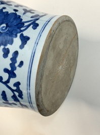 A Chinese blue and white vase and cover with floral design, Kangxi