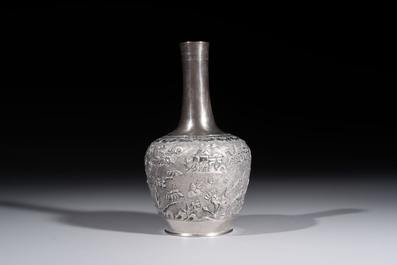 A Chinese Canton or Vietnamese silver bottle vase with landscape design and six cups, 19th C.