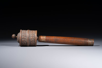 A varied collection of seven Tibetan ritual utensils, including a turquoise-inlaid silver relic holder, 19/20th C.