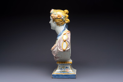 A large polychrome French faience monogrammed bust of a woman emblematic of spring, probably Rouen, early 19th C.