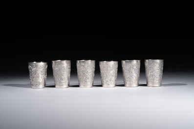 A Chinese Canton or Vietnamese silver bottle vase with landscape design and six cups, 19th C.