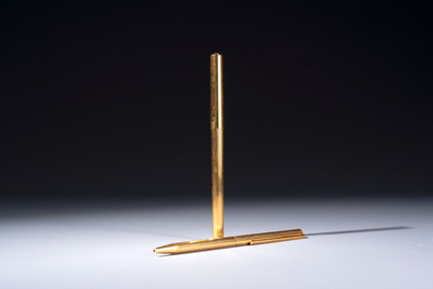 A gold-plated twist ballpoint pen and a fountain pen with an 18kt gold nib, S.T. Dupont Paris, France, 20th C.