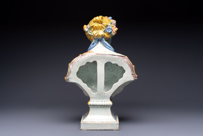 A large polychrome French faience monogrammed bust of a woman emblematic of spring, probably Rouen, early 19th C.