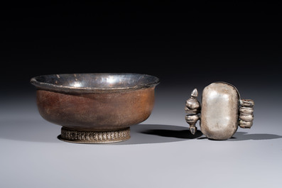 A varied collection of seven Tibetan ritual utensils, including a turquoise-inlaid silver relic holder, 19/20th C.
