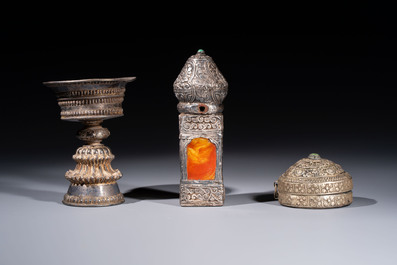 A varied collection of seven Tibetan ritual utensils, including a turquoise-inlaid silver relic holder, 19/20th C.