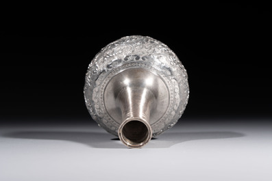 A Chinese Canton or Vietnamese silver bottle vase with landscape design and six cups, 19th C.