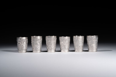 A Chinese Canton or Vietnamese silver bottle vase with landscape design and six cups, 19th C.