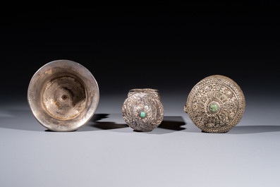 A varied collection of seven Tibetan ritual utensils, including a turquoise-inlaid silver relic holder, 19/20th C.