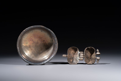 A varied collection of seven Tibetan ritual utensils, including a turquoise-inlaid silver relic holder, 19/20th C.