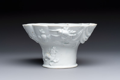 A very large Chinese Dehua blanc de Chine libation cup with a dragon, a qilin, a tiger and a crane, 18th C.