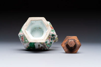 A rare Chinese famille verte puzzle jug with a wooden cover, Kangxi