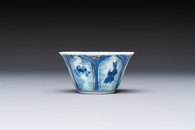 A Chinese European-decorated blue and white 'Fisherman' cup and saucer, Kangxi