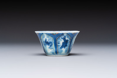 A Chinese European-decorated blue and white 'Fisherman' cup and saucer, Kangxi