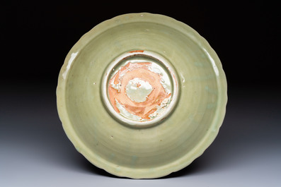 A Chinese Longquan celadon plate with incised floral design, Ming