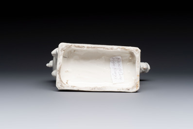 A Chinese Dehua blanc de Chine candlestick in the form a qilin, Kangxi