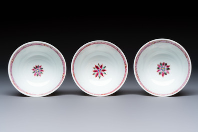 Three Chinese famille rose 'Birds and Plum Trees' cups and saucers, Yongzheng