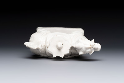 A Chinese Dehua blanc de Chine candlestick in the form a qilin, Kangxi