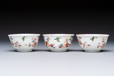 Three Chinese famille rose 'Birds and Plum Trees' cups and saucers, Yongzheng