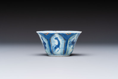 A Chinese European-decorated blue and white 'Fisherman' cup and saucer, Kangxi