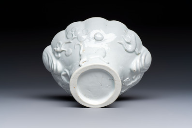 A very large Chinese Dehua blanc de Chine libation cup with a dragon, a qilin, a tiger and a crane, 18th C.