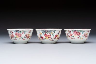 Three Chinese famille rose 'Birds and Plum Trees' cups and saucers, Yongzheng