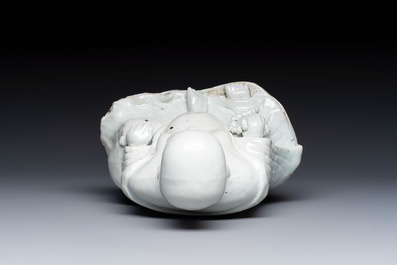 A Chinese white-glazed Milefo Buddha, 19th C.