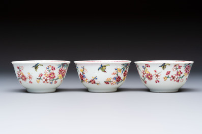 Three Chinese famille rose 'Birds and Plum Trees' cups and saucers, Yongzheng