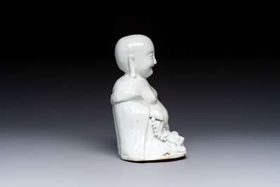 A Chinese white-glazed Milefo Buddha, 19th C.