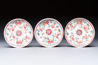 Three Chinese famille rose 'Birds and Plum Trees' cups and saucers, Yongzheng