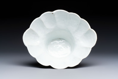 A very large Chinese Dehua blanc de Chine libation cup with a dragon, a qilin, a tiger and a crane, 18th C.
