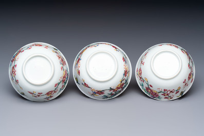 Three Chinese famille rose 'Birds and Plum Trees' cups and saucers, Yongzheng