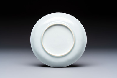 A Chinese European-decorated blue and white 'Fisherman' cup and saucer, Kangxi