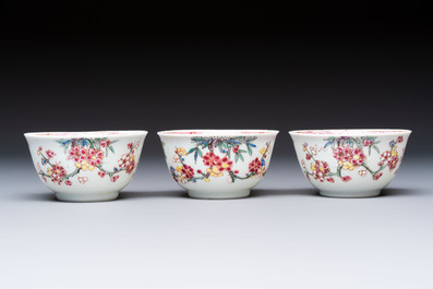 Three Chinese famille rose 'Birds and Plum Trees' cups and saucers, Yongzheng