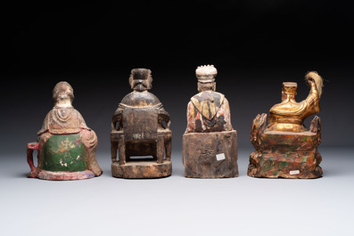Eight Chinese carved wooden sculptures with traces of polychromy and gilding, 19th C.