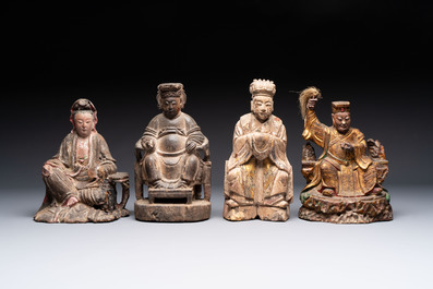 Eight Chinese carved wooden sculptures with traces of polychromy and gilding, 19th C.