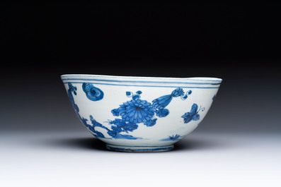 A Chinese blue and white 'Butterflies and Flowers' bowl, Transitional period