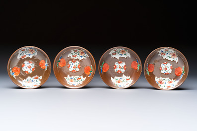 A Chinese famille rose capucine-ground covered teapot with floral design, seven cups and saucers, Yongzheng/Qianlong