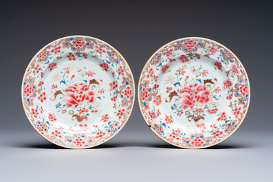 Eight Chinese famille rose plates with floral design and a 'Rooster' teapot, Yongzheng/Qianlong
