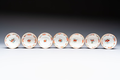 A Chinese famille rose capucine-ground covered teapot with floral design, seven cups and saucers, Yongzheng/Qianlong