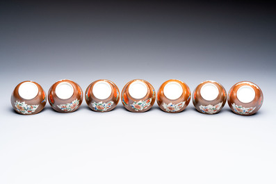 A Chinese famille rose capucine-ground covered teapot with floral design, seven cups and saucers, Yongzheng/Qianlong