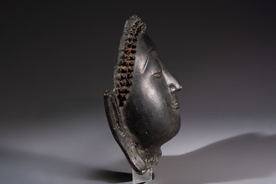 A Cambodian bronze Buddha and a Thai Buddha head, 19th C.