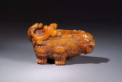 A Chinese precious-stone-inlaid carved soapstone wine vessel on stand, Gong 觥, Republic