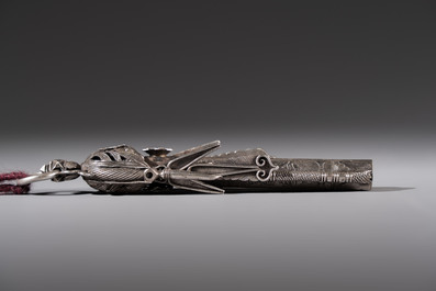 A fine Chinese silver pendant with inscriptions on a plexiglas stand, 19th C.