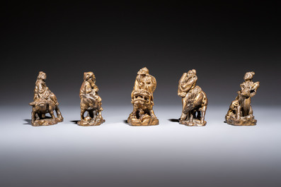 Five Chinese bronze 'Immortal' groups and a carved soapstone 'Monkeys' sculpture, 20th C.