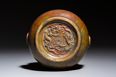 A Chinese bronze censer with lion-head handles and relief dragon design, Lu Gu Zhai 侶古齋 mark, 18/19th C.